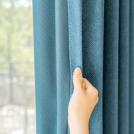 a person's hand is peeking through the curtains