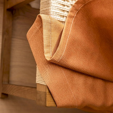 a close up of a piece of cloth on a chair