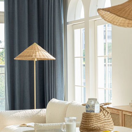 a living room filled with furniture and a large window