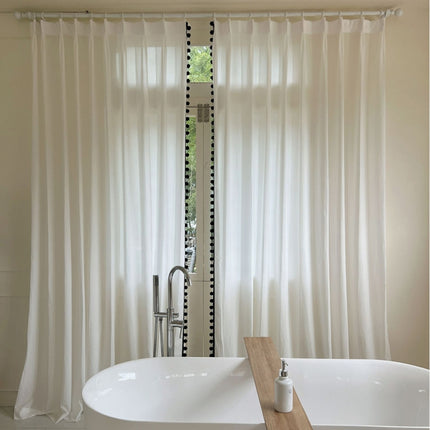 a white bath tub sitting next to a window