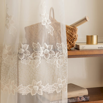 a shelf with a basket, a basket, and a curtain