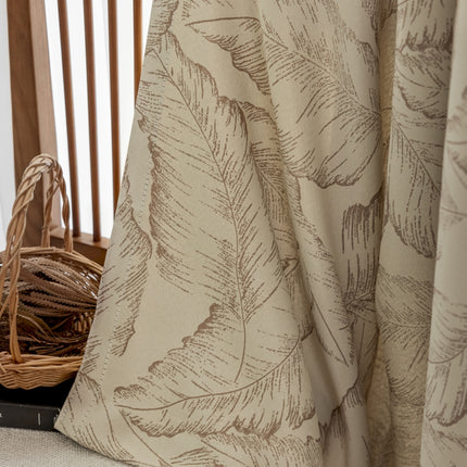 a basket sitting on top of a table next to a curtain