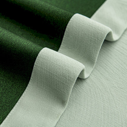a close up of a green and white fabric