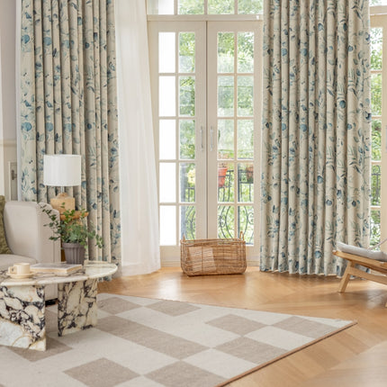 a living room filled with furniture and a large window