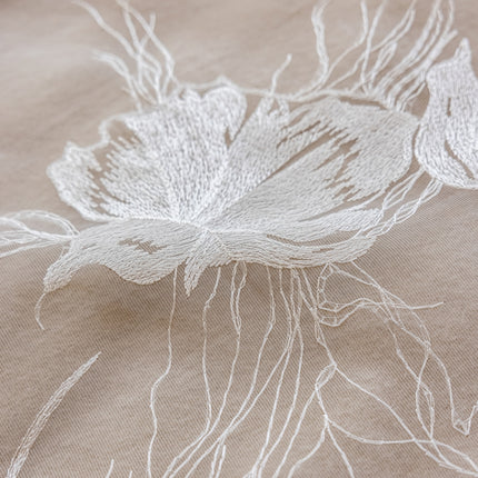 a close up of a flower on a cloth