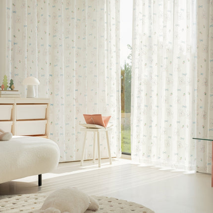 a bedroom with a white bed and a white rug