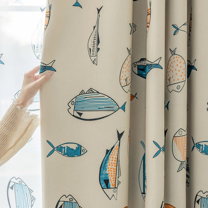 a woman is looking out a window with fish on it