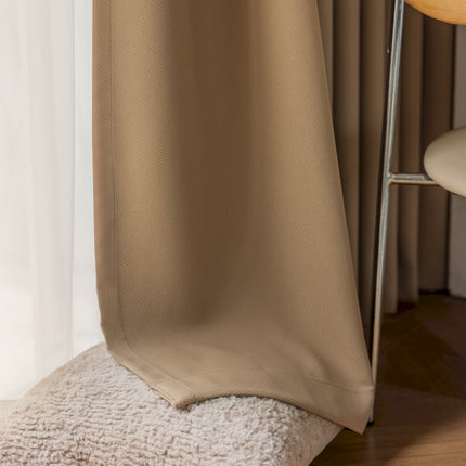 a chair and a curtain in a room