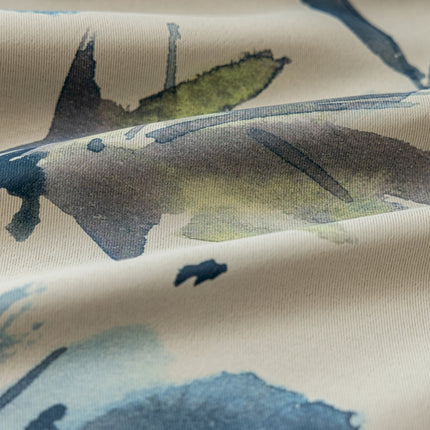 a close up of a fabric with leaves on it