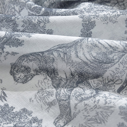 a close up of a fabric with animals on it