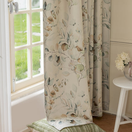 a window with a curtain and a chair in front of it