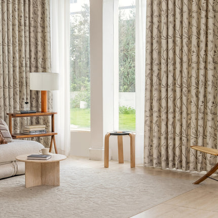 a living room filled with furniture and a large window
