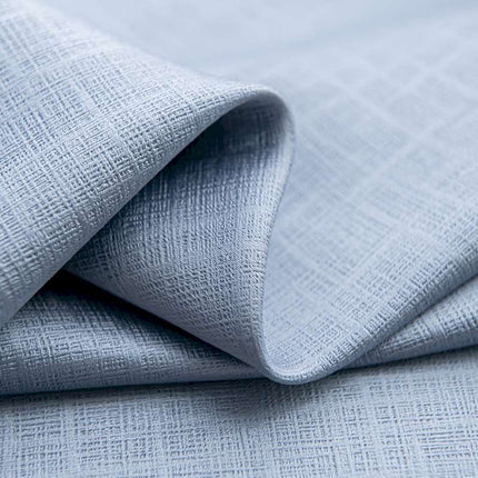 a close up of a light blue fabric