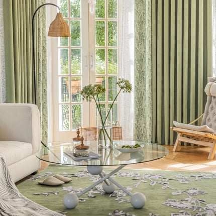 a living room filled with furniture and a large window
