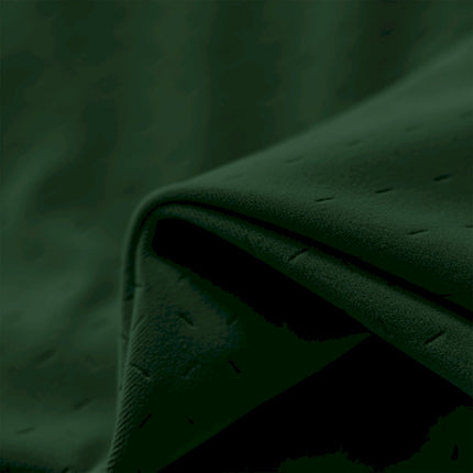 a close up view of a green fabric