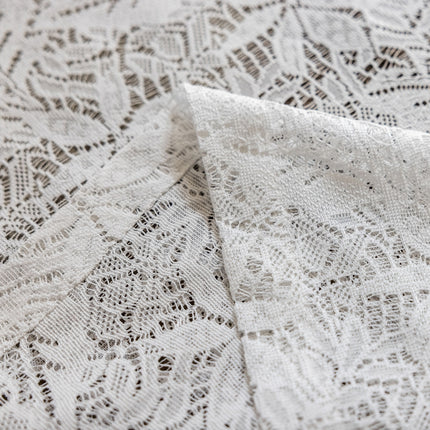 a close up of a white lace fabric
