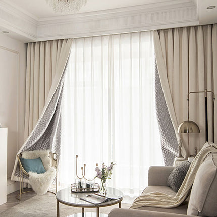 a living room filled with furniture and a chandelier