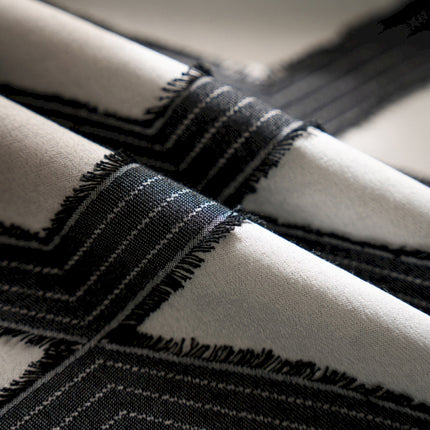 a close up of a black and white blanket