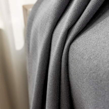 a close up of a bed with a blanket on top of it