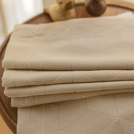 a close up of a folded sheet on a table