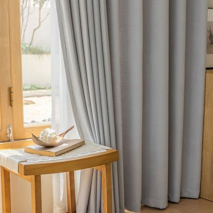 a wooden table sitting next to a window