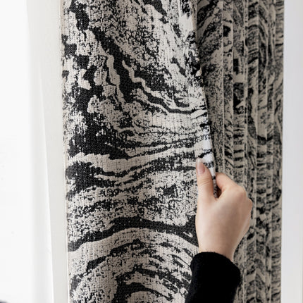 a person is writing on a wall with a pen