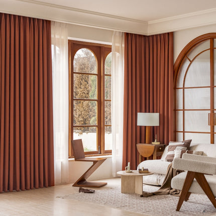 a living room filled with furniture and a large window