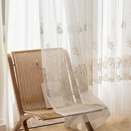 a pair of chairs sitting in front of a window