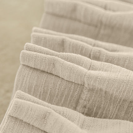 a row of folded towels sitting on top of each other