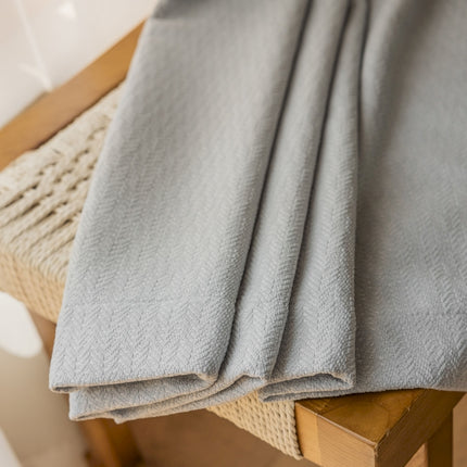 a close up of a blanket on a chair