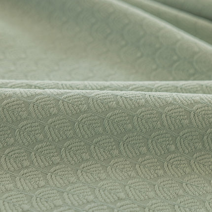 a close up shot of a green fabric