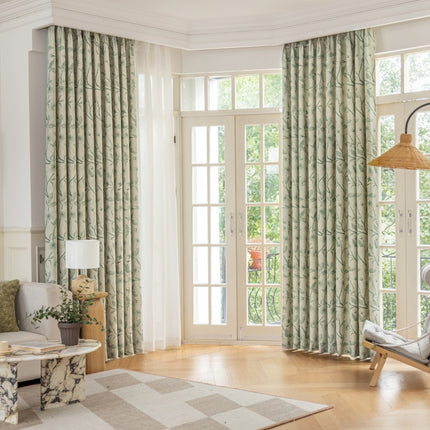 a living room filled with furniture and a large window