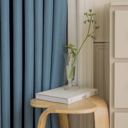 a vase of flowers sitting on top of a book