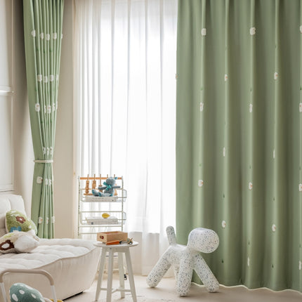 a child's room with green curtains and a white teddy bear