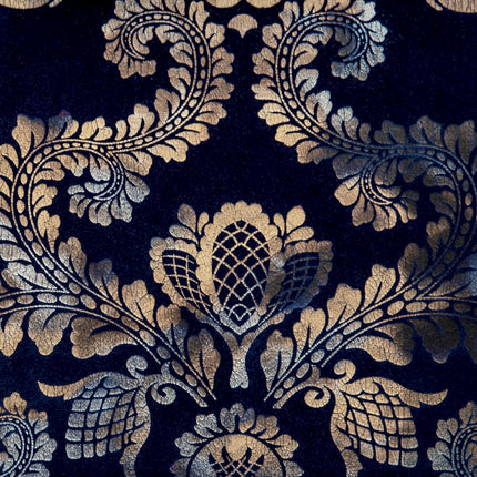 a close up of a black and gold wallpaper