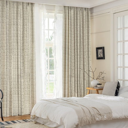 a bedroom with a bed and a chair