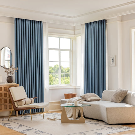 a living room filled with furniture and a large window