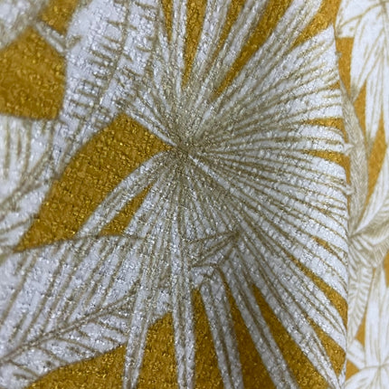 a close up of a yellow and white fabric