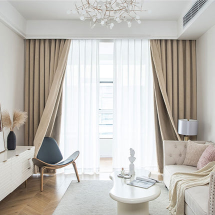 a living room filled with furniture and a chandelier