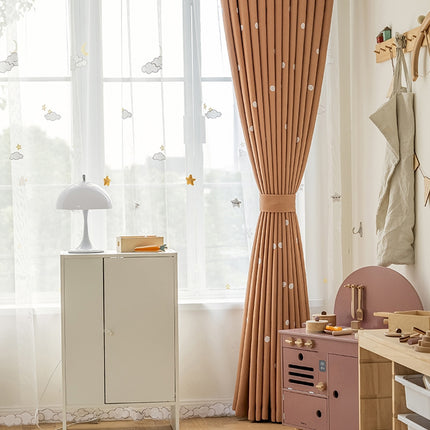 a child's room with pink furniture and curtains
