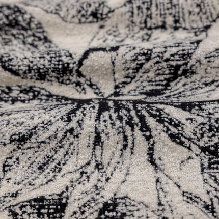 a close up of a black and white area rug