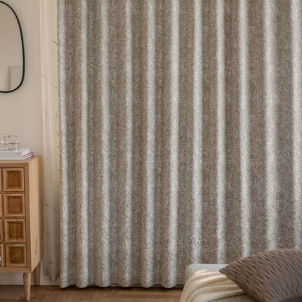 a bedroom scene with focus on the curtain