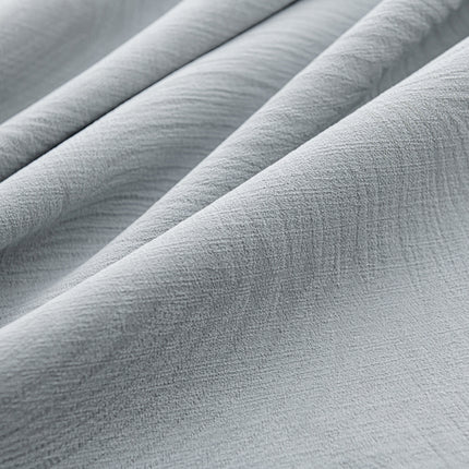 a close up view of a white fabric