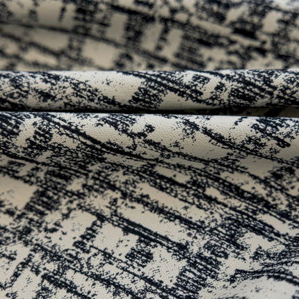 a close up of a black and white fabric