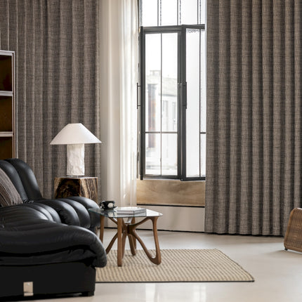 a living room filled with furniture and a large window