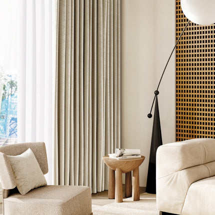 a living room with a white couch and a chair