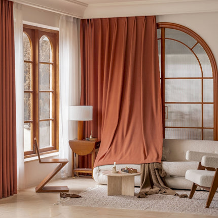 a living room filled with furniture and a large window