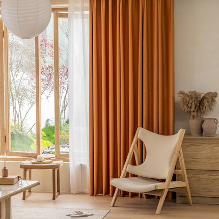 a living room filled with furniture and a large window