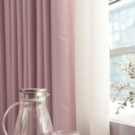 a vase of flowers sitting next to a window