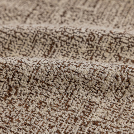 a close up of a brown and white blanket